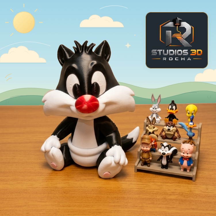 Frajola bebê em destaque ao lado de miniaturas dos personagens Looney Tunes, em arte do perfil.